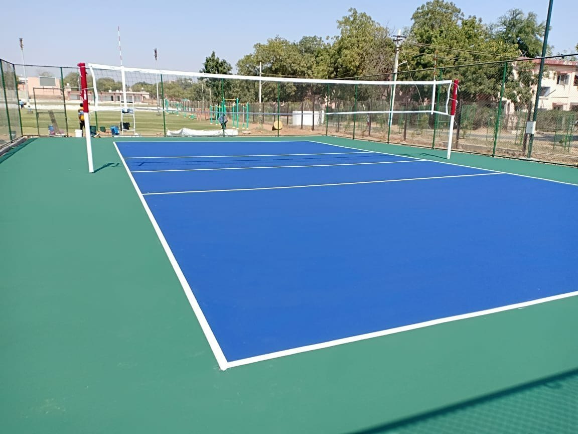 Volleyball court with blue surface and green free zones