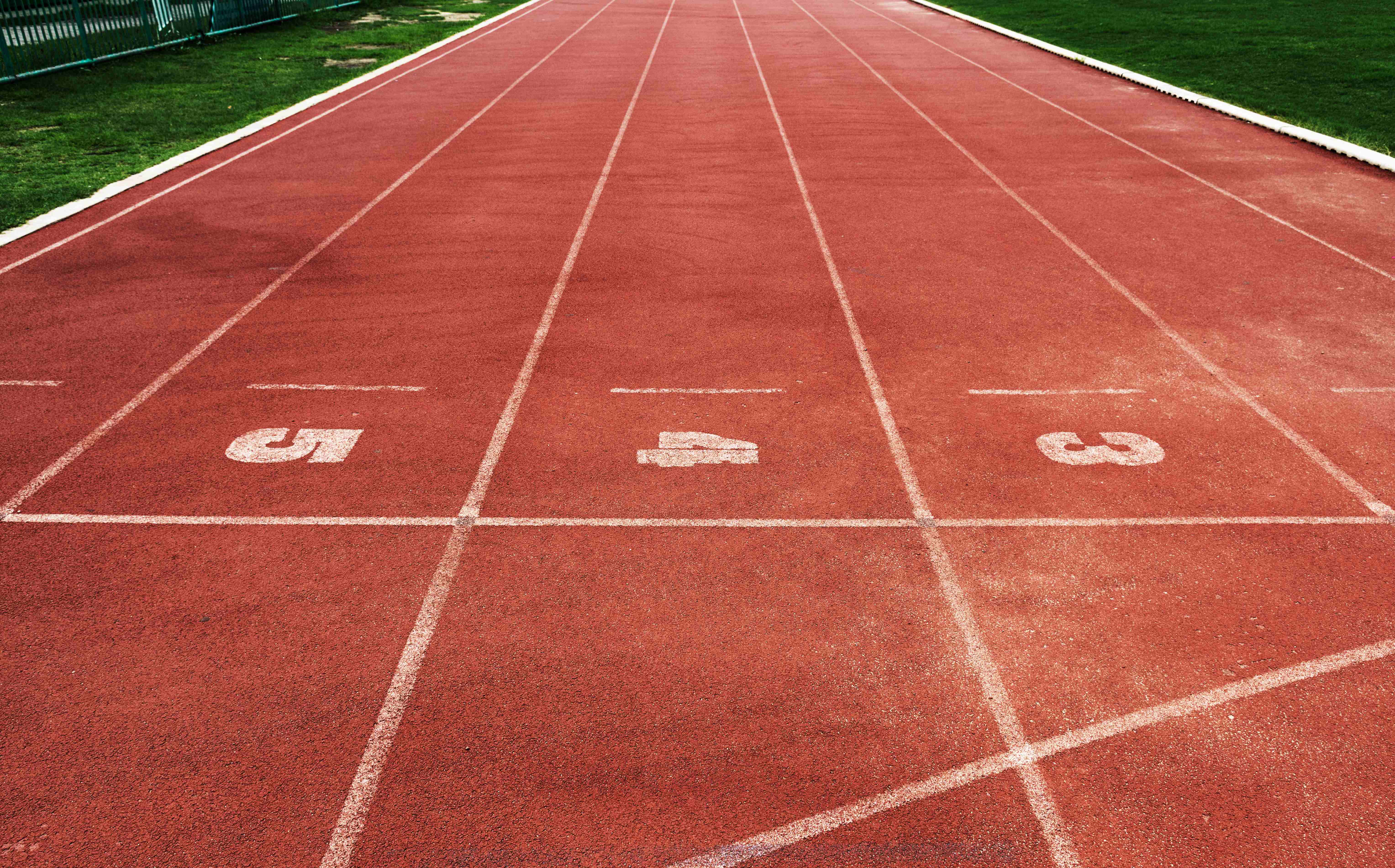 Running Track Flooring - Close-up of Red Track Lanes with Numbers 6, 7, 8