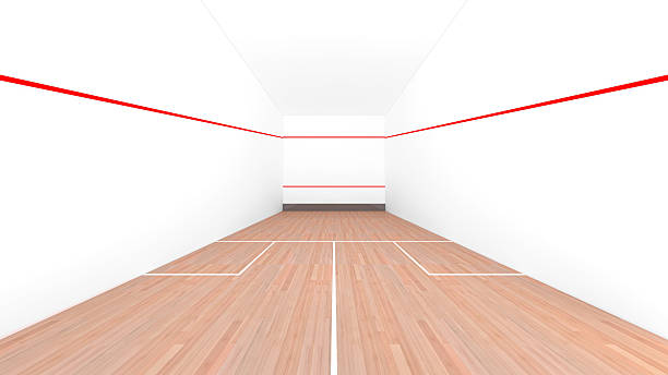 Modern squash court with pristine white walls and wooden floor